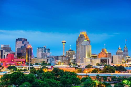a view of the city skyline at dusk at #12 The Gruene Room at Garrison in Gruene in New Braunfels