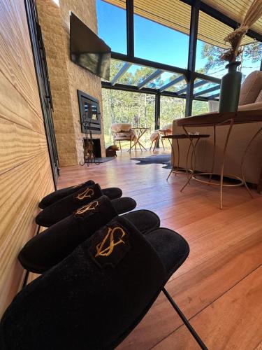a room with a bunch of black blankets on the floor at SEGREDO do VALLE - BOSQUE in Urubici