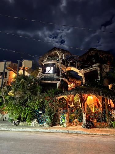 a building that is sitting on the side of the street at La Quinta Orquídea in Puerto Morelos