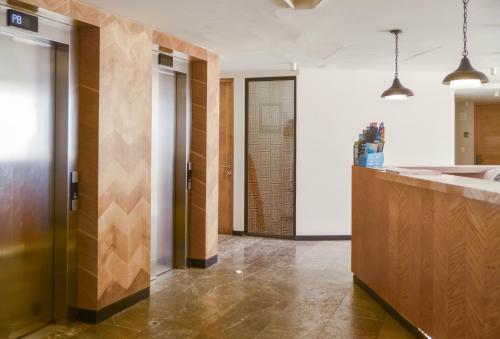 a bathroom with a sink and a counter in a room at It Beach Condo in Playa del Carmen