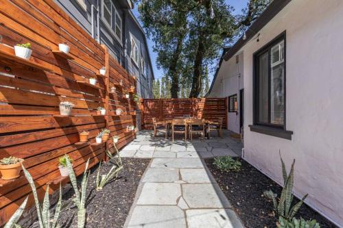 a patio of a house with a wooden wall at Casita Monterey Pet-Friendly Sonoma Escape in Sonoma