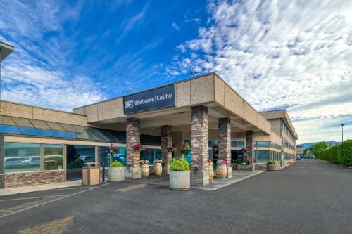 a building with a sign on the front of it at Sandman Hotel Penticton in Penticton