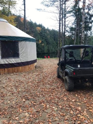 a golf cart parked next to a tent at Alderbrook Yurt in Warrensburg