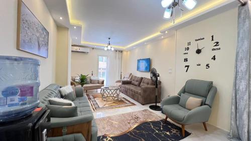 a living room with a fish tank on the wall at Alexandria Apartment Best Vacation Group Families or Elderly people only in Alexandria