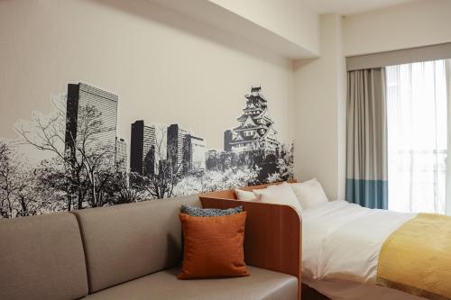 Postel nebo postele na pokoji v ubytování yksi STAY ＆ APARTMENT OSAKA