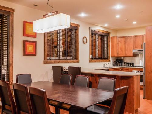 a kitchen with a dining room table and chairs at Gouka Chalet in Kutchan