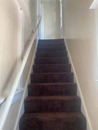 a flight of stairs in a hallway at Magnolia APT 2 in Lansing