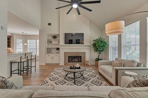 a living room with a couch and a fireplace at New!4BR with Easy Access to all Woodlands Amenities in The Woodlands
