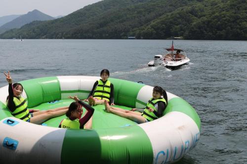 a group of girls are sitting on an inflatable at Avianto kids poolvilla in Gapyeong