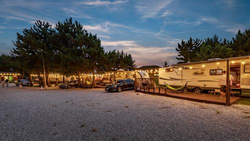 a group of rvs parked in a parking lot at Yangyang Hajodae Campingcar in Yangyang