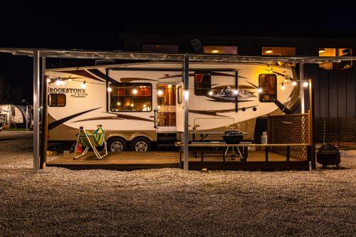 an rv parked in a garage at night at Yangyang Hajodae Campingcar in Yangyang