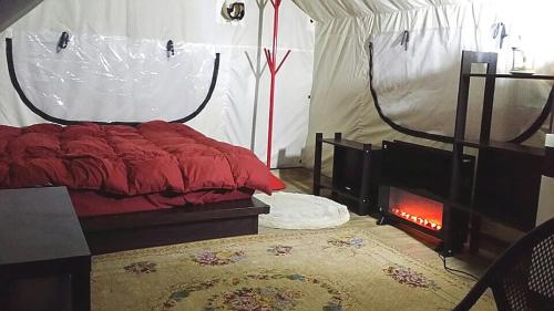 Katil atau katil-katil dalam bilik di Andong Looksglampingandpam