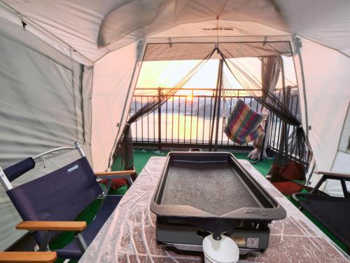 an inside of a tent with a stove in it at Chuncheon Kerensia Pension in Chuncheon