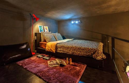 a bedroom with a leopard print bed and a table at Chuncheon Pier Star Pension in Chuncheon