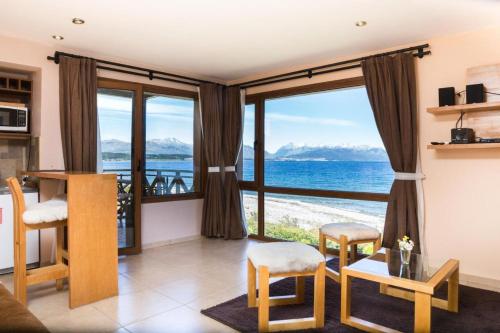 a living room with a view of the ocean at Blue Aparts Dina Huapi Bariloche in Dina Huapi