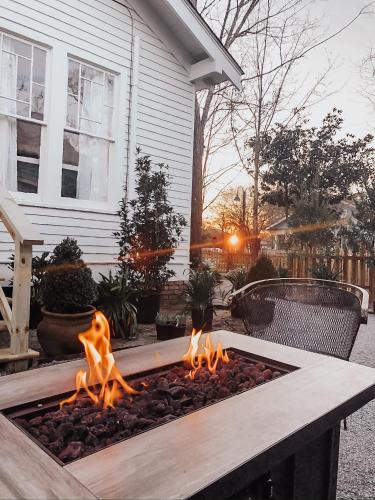 a fire pit in front of a house at Guesthouse on Girod in Mandeville