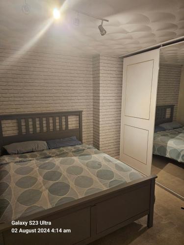 a bedroom with a bed and a white door at Peace and Love House in Kent