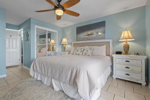 a bedroom with a bed and a ceiling fan at Buena Vista 205 in Gulf Shores
