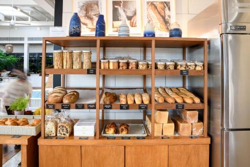 a bakery with shelves filled with bread and pastries at Putahracsa Hua Hin in Hua Hin
