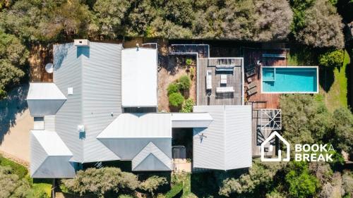 an aerial view of a house with a swimming pool at Clovelly of Portsea - Heated Pool Spa Luxury in Portsea