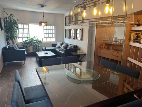 a living room with a couch and a table at Corazón de México in Mexico City