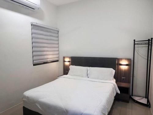 Postel nebo postele na pokoji v ubytování Modern Home Ipoh 10 to 14pax