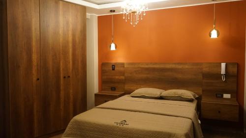 Ένα ή περισσότερα κρεβάτια σε δωμάτιο στο Ukumari Hotel