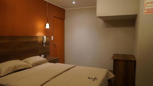 Ένα ή περισσότερα κρεβάτια σε δωμάτιο στο Ukumari Hotel