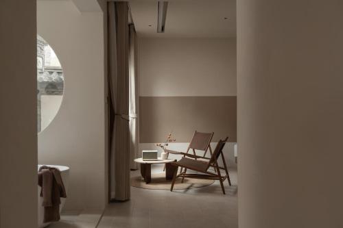 Posezení v ubytování Shijing Hotel in Dali-大理柿井美宿