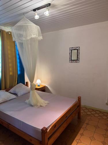 En eller flere senge i et værelse på Kactus-Kréyol