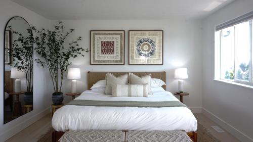a bedroom with a large bed with white sheets and pillows at *NEW* Sunset Ridge Marysville 5 Beds 4 Baths in Marysville