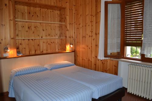 Кровать или кровати в номере Hotel Miramonti