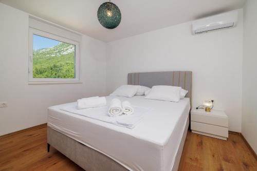 Postel nebo postele na pokoji v ubytování Villa Kelava