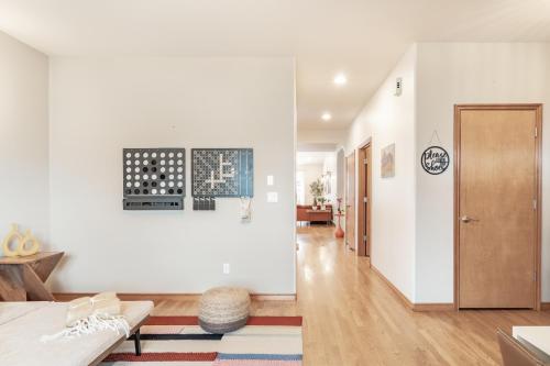 a living room with white walls and a hallway at Luxury Home - Reading & Game Room - Outdoor Dining home in Bellingham