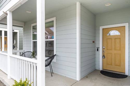 a front door of a house with a bench at Luxury Home - Reading & Game Room - Outdoor Dining home in Bellingham