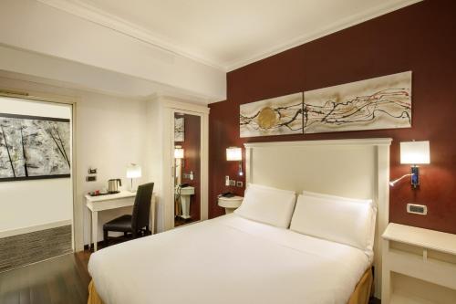 Postel nebo postele na pokoji v ubytování Trilussa Palace Hotel Congress & Spa