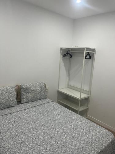 Ένα ή περισσότερα κρεβάτια σε δωμάτιο στο Martiapartamento
