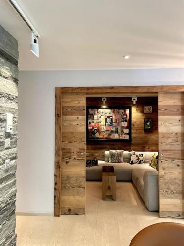 a living room with a couch and a table at Private luxury 4 bedroom apartment in Flims Waldhaus in Flims