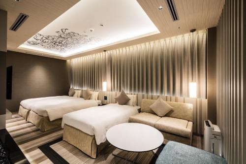 Postel nebo postele na pokoji v ubytování ALFIT HOTEL & BAR AKASAKA
