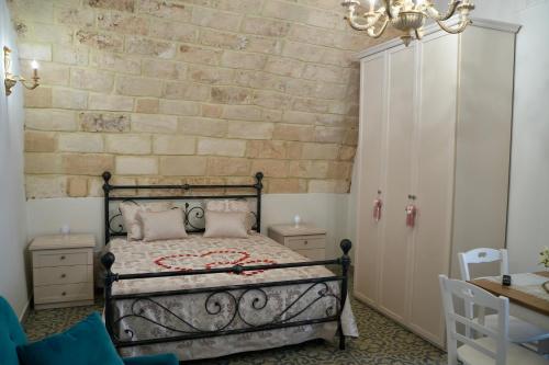 Una cama o camas en una habitación de B&B San Carlo
