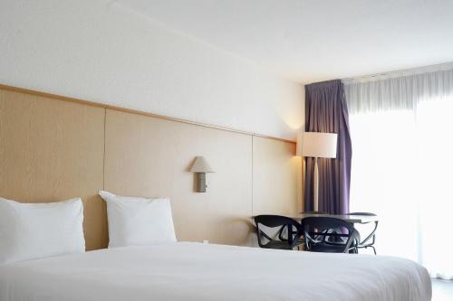 Katil atau katil-katil dalam bilik di Thalazur Antibes - Résidence & Spa