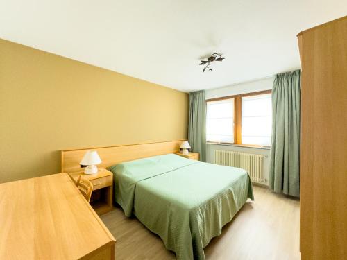 Postel nebo postele na pokoji v ubytování Hotel Belvedere Wellness&SPA