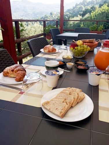 a table topped with plates of food on top at Agriturismo Nonno Ninuccio in Gioi