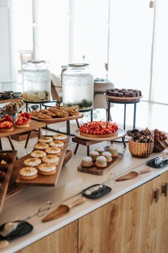 a buffet filled with lots of different types of pastries at Sofitel Golfe d'Ajaccio Thalassa Sea & Spa in Ajaccio