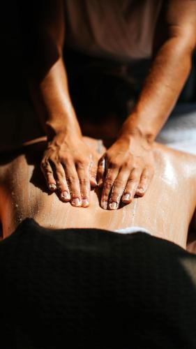 a person is working on a piece of leather at Sofitel Golfe d'Ajaccio Thalassa Sea & Spa in Ajaccio