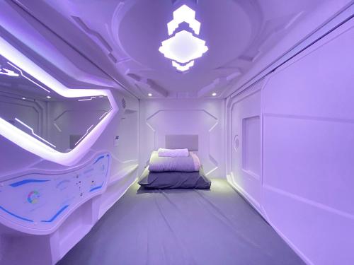 Postel nebo postele na pokoji v ubytování U Capsule Hotel Kulai
