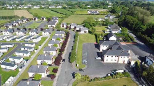 an aerial view of a residential neighborhood with houses at Gold Coast Resort Dungarvan in Dungarvan