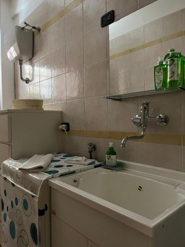 a bathroom with a sink and a mirror at Normanni 28 - Private and Guest House in Campagna