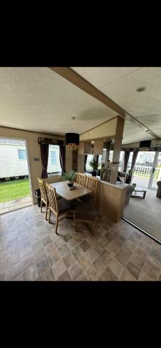 a dining room with a table and chairs at 8 berth Waterside Ingoldmells Santanavan 8 C22 in Ingoldmells
