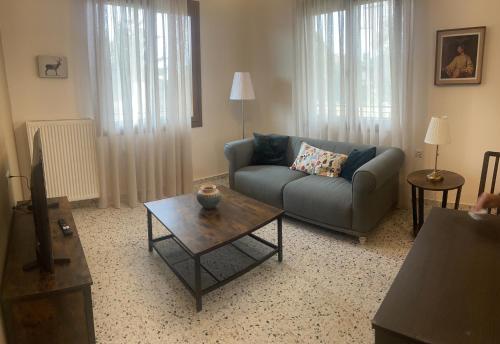 a living room with a couch and a coffee table at Old Castle 1 in Palaiókastron